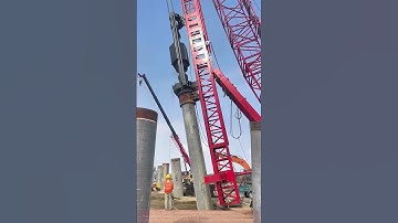 Red Piling Machine Roars into Action – Witnessing Engineering Miracles!”