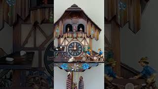 MD424-12 12 1 Day Musical Cuckoo Clock w/ Men Sawing Wood, Waterwheel, and Dancers Closeup at 9:00