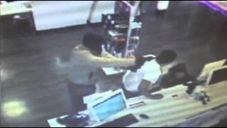 Surveillance photos show men accused of robbing T-Mobile store