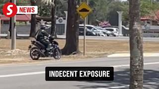 Police tracking down suspected flasher near the entrance of a university in Dungun