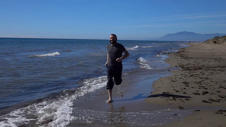 handsomehappy man running by sea