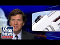 Tucker reacts to Biden's public fall up Air Force 1 stairs