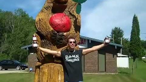 Johnny Rock from Sykofish Visits Traverse Bay Farms & the Iconic Cherry Bear Chainsaw Sculpture