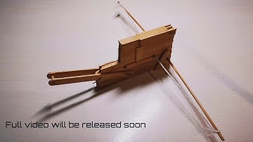 Testing the repeating crossbow made with popsicle sticks