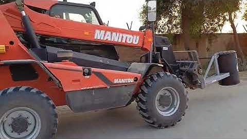 Manitou Telehandler with drum handler attachment