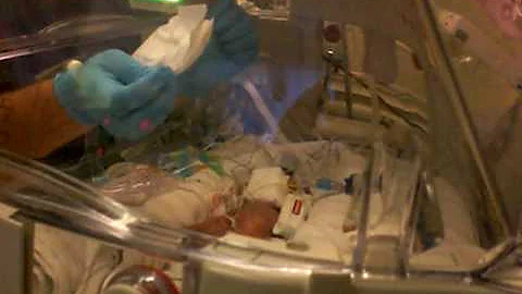 Casey Meeks holding Addison for the first time
