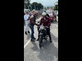 Man helps woman start her 38 scott at hill climb then they go