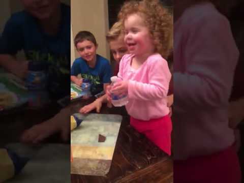 little girl flips bottle and dabs