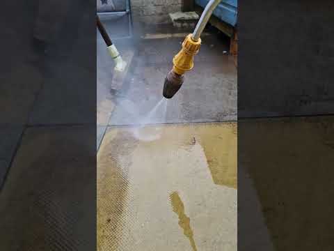 Pressure washing outside chicken coop with VTUF hot washer