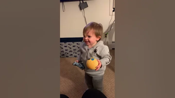 Toddler contagious laugh while playing fetch