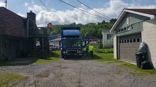 Republic Services Mack LR Heil Curroto Can front loader on trash pickup.