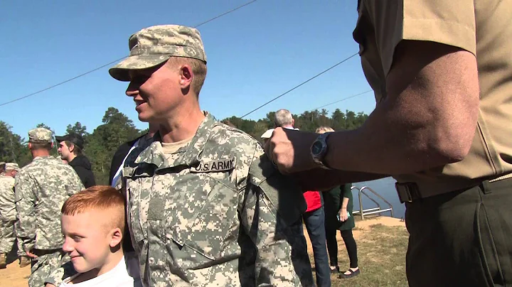MAJ Lisa Jaster's husband pins Ranger Tab on her s...