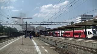 SSN 65 018 met rijtuigen+01 1075 vertrekken van station Dordrecht