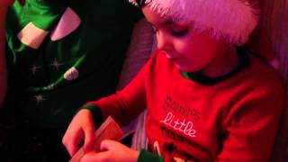 Seb reading The Dinosaur That Pooped Christmas