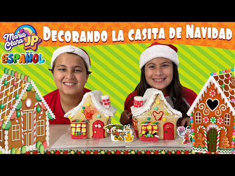 Maria Clara y JP decoran casitas de galletas para Navidad