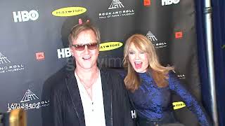 Jerry Cantrell and Nancy Wilson goofing off on the red carpet of the 2013 Rock & Roll Hall of Fame