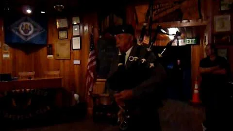 Lynne Miller playing the bagpipes at the Moto Mele...