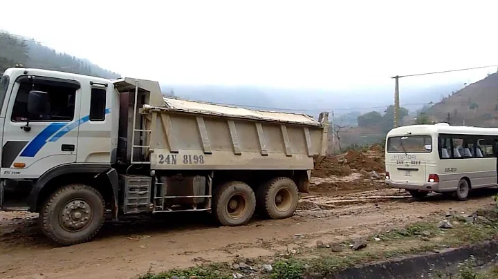 Minibus being towed near Sin Cheng, Vietnam