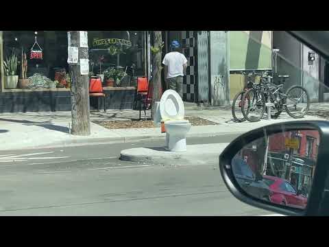 Toilet on college street sidewalk - Toronto Canada May 7, 2024