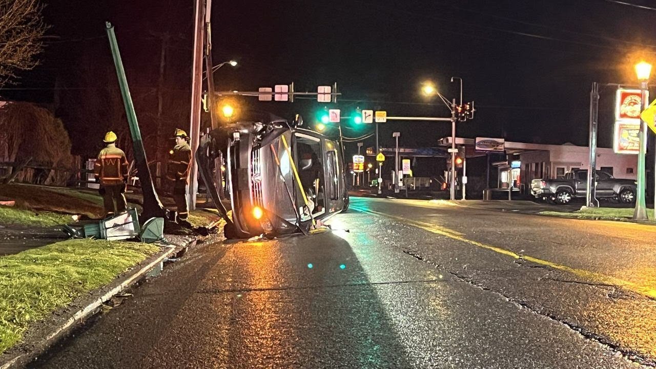 Car flips on Washington Street, driver walks away uninjured - YouTube