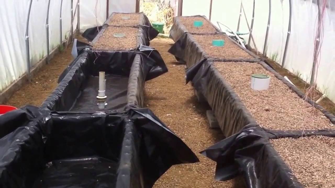 Sustainable farming setting up aquaponic gravel beds - YouTube