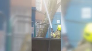 Firefighters Putting Out Burning Building