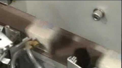 Label Applicator applying security seal labels to a box.