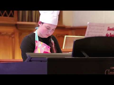 Gabrielle Moore plays piano at the 2018 Halloween Recital