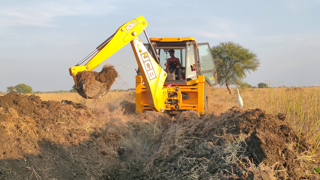 JCB 3DX Machine Breaking to Remove unwanted Rocks Drain Land