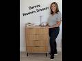Modern Garvee dresser with fluted drawers, black accented handles and legs with safety brackets!