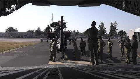 Boeing C-17 Globemaster III Loading AH-64 Apache Helicopter
