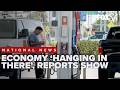 Economy 'hanging in there' as reports show slow growth, rising inflation