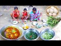 santali tribe mother served to her children&#39;s egg poch curry and jute leaves recipe at lunch