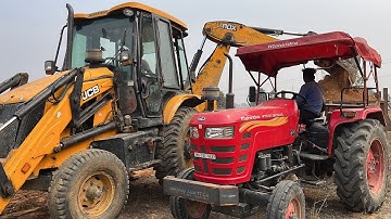 Jcb 3dx backhoe loader loading mud in mahindra yuvo tractor trolley for making pond in village | JCB