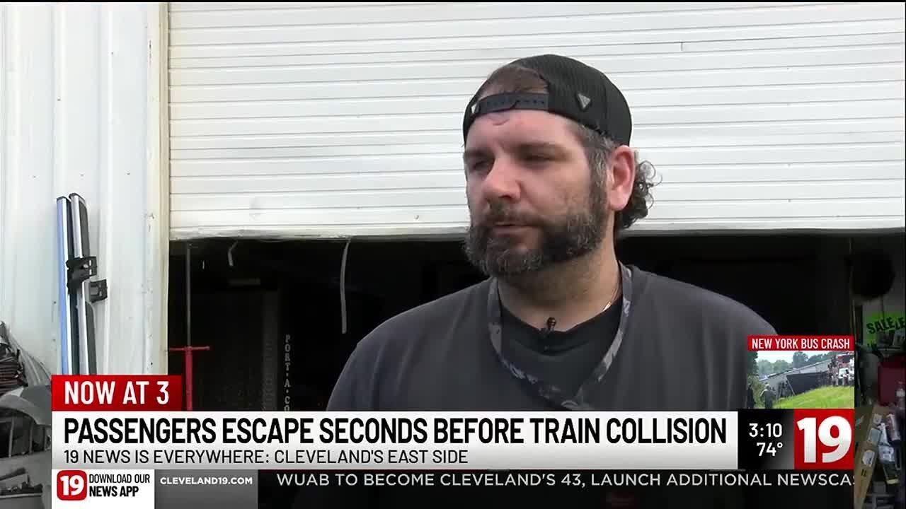 Passengers in car stuck on train tracks escape seconds before collision ...