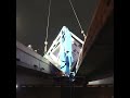 Shipping container gets stuck between freeway