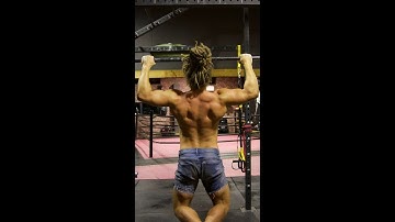 Muscular 90kg Tane Davison monkey-bar calisthenics warm-up.