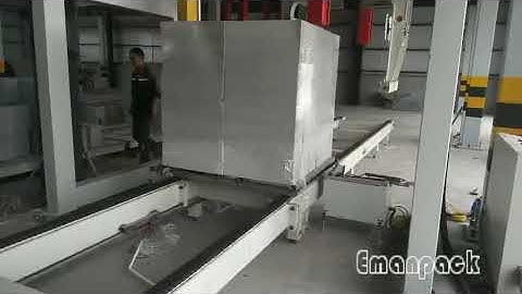 Building material packaging by rotary arm pallet wrapper