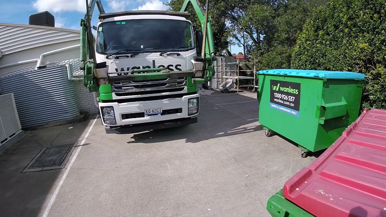 E102.3 POV DRIVING THE TRUCK. VERY SMALL STREET. WASTE MANAGEMENT. 