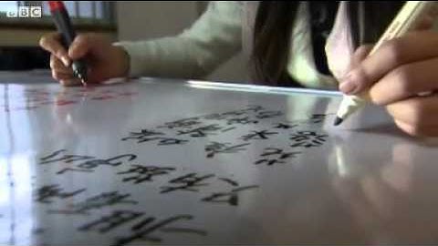 BBC News   Two hands writing two different languages mp4