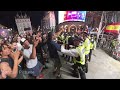 England fans CHASE Argentine supporters through London and clash with police during World Cup melee