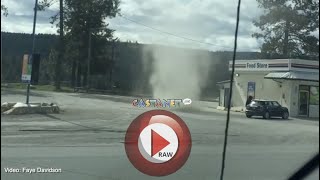 Dust devil swirls by highway