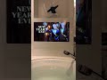 A bathroom mirror… until it turns into a private cinema.