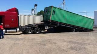 Unloading a container from landoll trailer