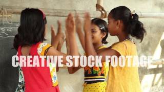 Four Girl Students Play A Clapping Game In A Village School In Bengal, India