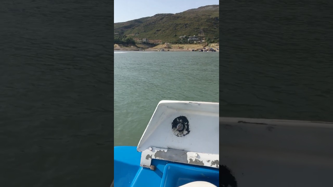 boat riding between mountains 