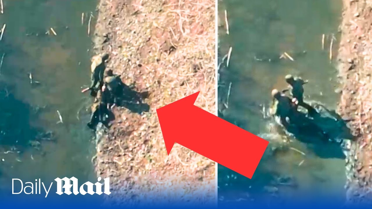 Fleeing Russian soldiers carry wounded comrade and drink from drainage ditch near Bakhmut