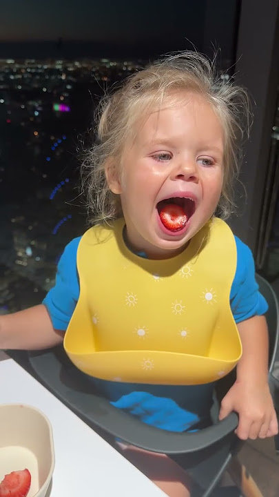 Funny Kids eating! Children are eating tasty strawberry