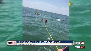 Coast Guard rescues two from capsized boat