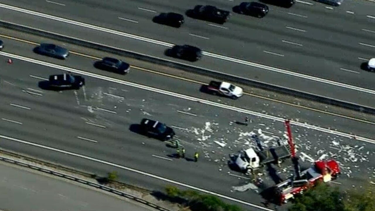 Lanes blocked on I-85 after truck overturns, spills load - YouTube